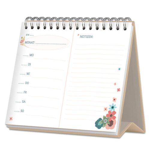 Ein spiralgebundener Tischkalender mit Wochenplanung und Blumendekoration.