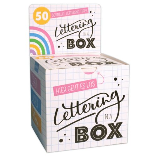 Box mit „Lettering in a Box“-Text, Regenbogengrafik und Gittermuster. Enthält 50 Lettering-Tipps auf Deutsch.